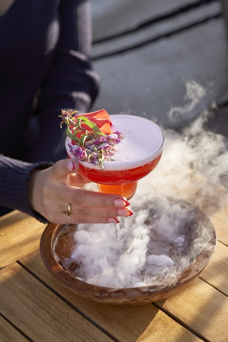 Breathtaking panoramic view of the snow-capped Atlas Mountains from the shaded rooftop terrace at Almaha Marrakech